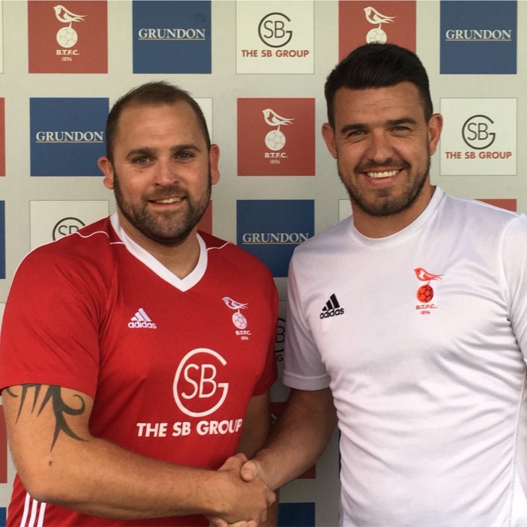 Bracknell Town defender Matt Day with Carl Davies. Photo: Bracknell Town FC.