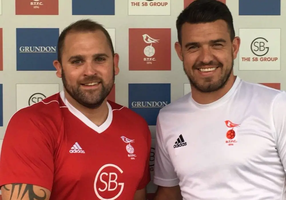 Bracknell Town defender Matt Day with Carl Davies. Photo: Bracknell Town FC.
