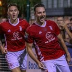 Adam Cornell celebrates scoring against Kingstonian. Photo: Neil Graham.