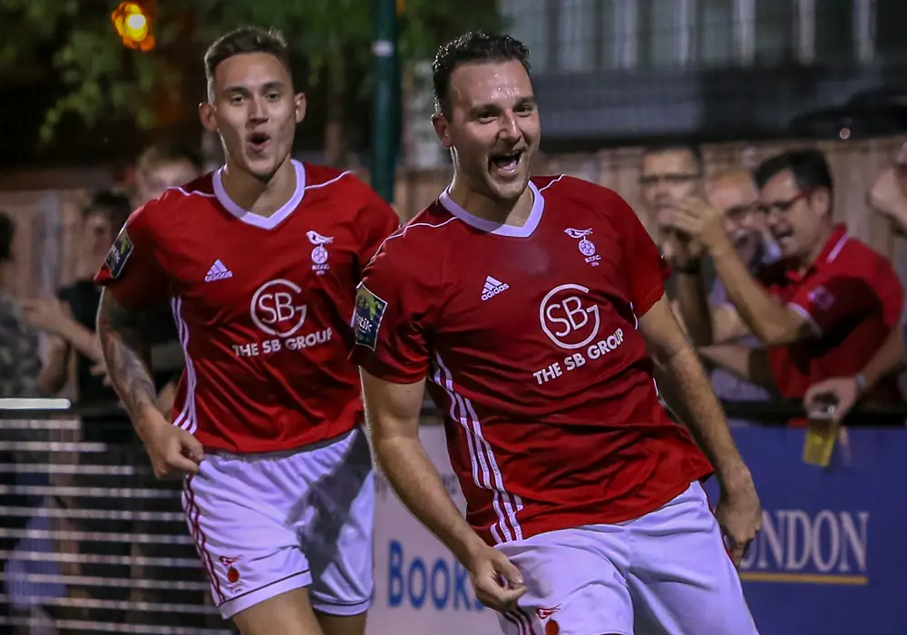 Adam Cornell celebrates scoring against Kingstonian. Photo: Neil Graham.