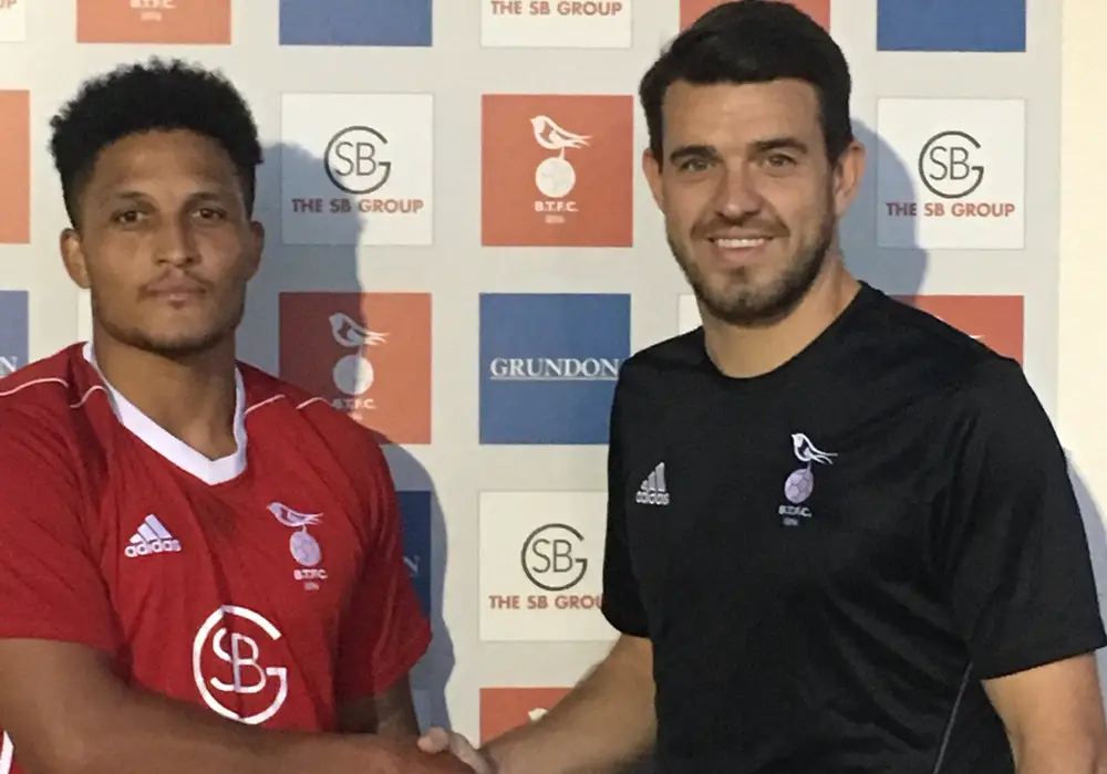 New Bracknell Town midfielder Harrison Bayley with manager Carl Davies. Photo: Bracknell Town FC.