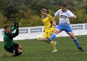 Cameron Miller scoring for Eversley & California FC. Photo: Richard Milam.