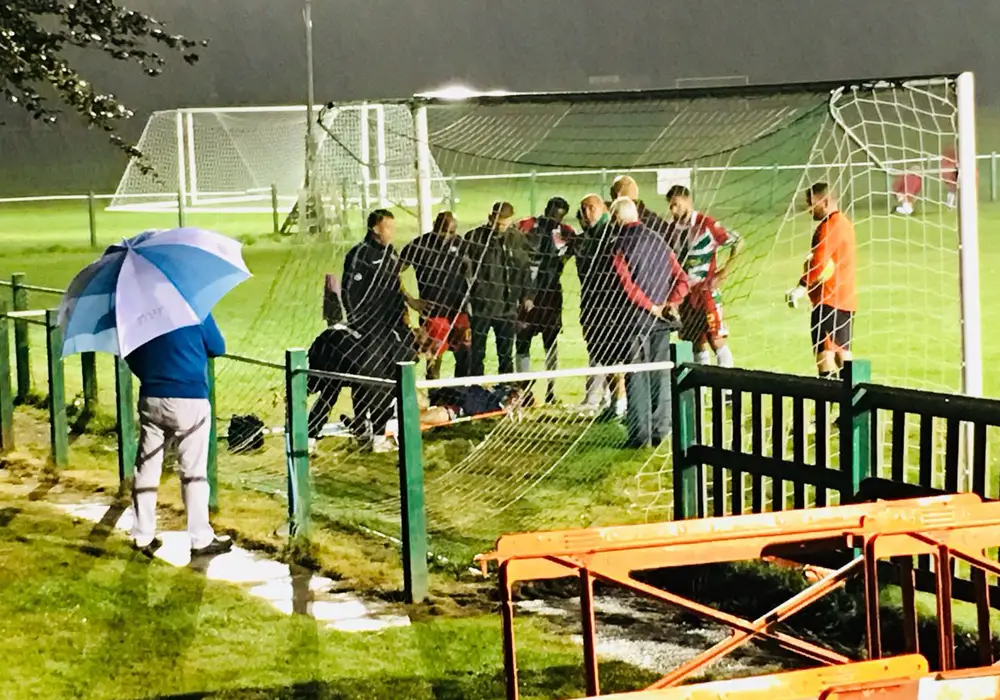 Dan Roberts is stretchered off for Windsor. Photo: Paul Smithson.