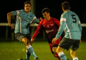 Carlo Santoro takes on Woodley United for Binfield. Photo: Neil Graham.