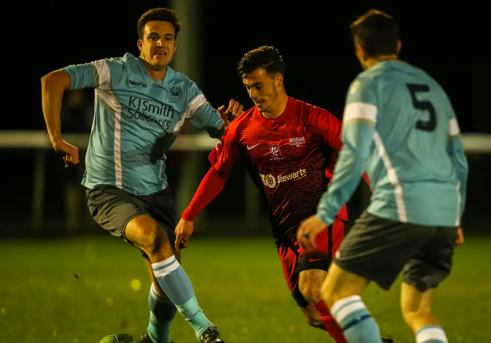 Carlo Santoro takes on Woodley United for Binfield. Photo: Neil Graham.