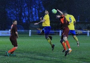 Fabienne Etienne (5) jumps highest to score for Ascot United. Photo: Rob Mack/Shooting Stars