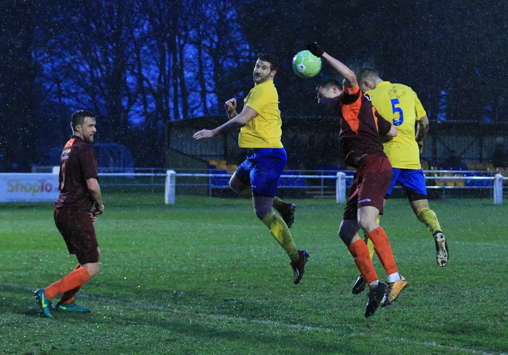 Fabienne Etienne (5) jumps highest to score for Ascot United. Photo: Rob Mack/Shooting Stars