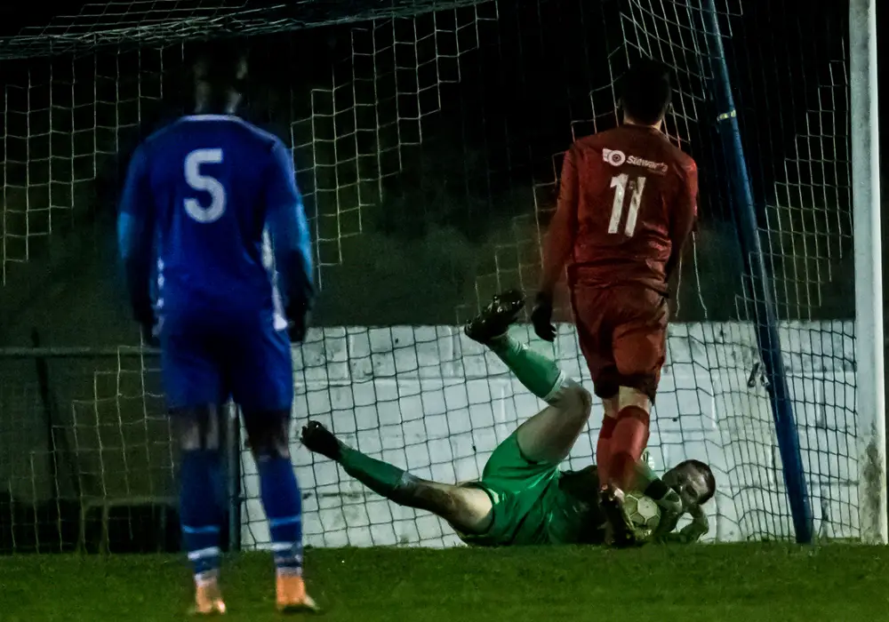 Matt Carr makes a Reading City penalty save. Photo: Neil Graham.