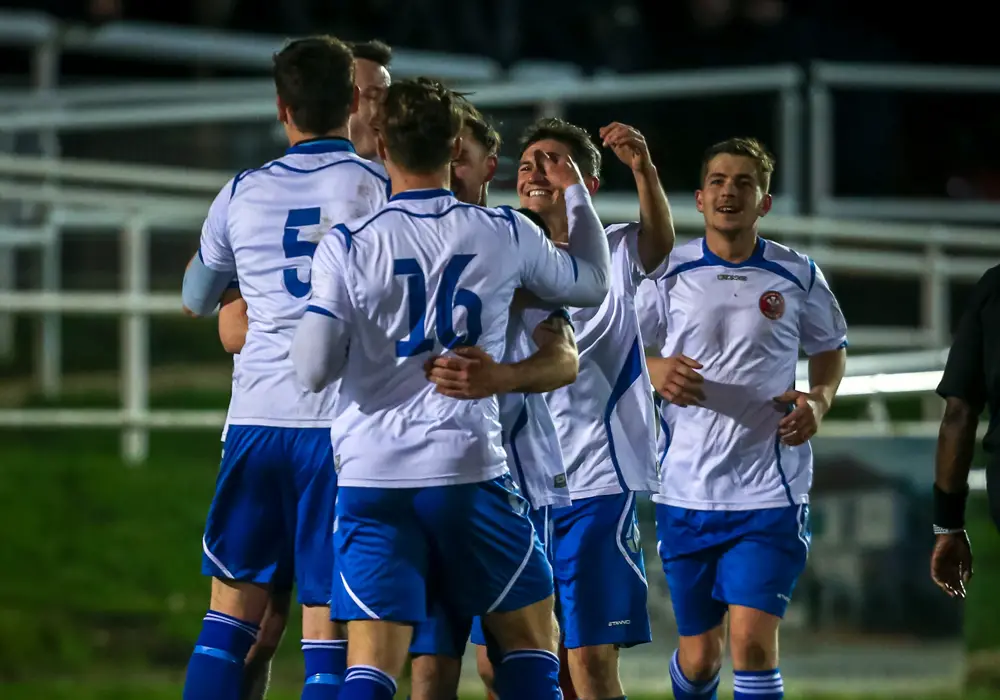 Virginia Water celebrate a goal. Photo: Neil Graham.