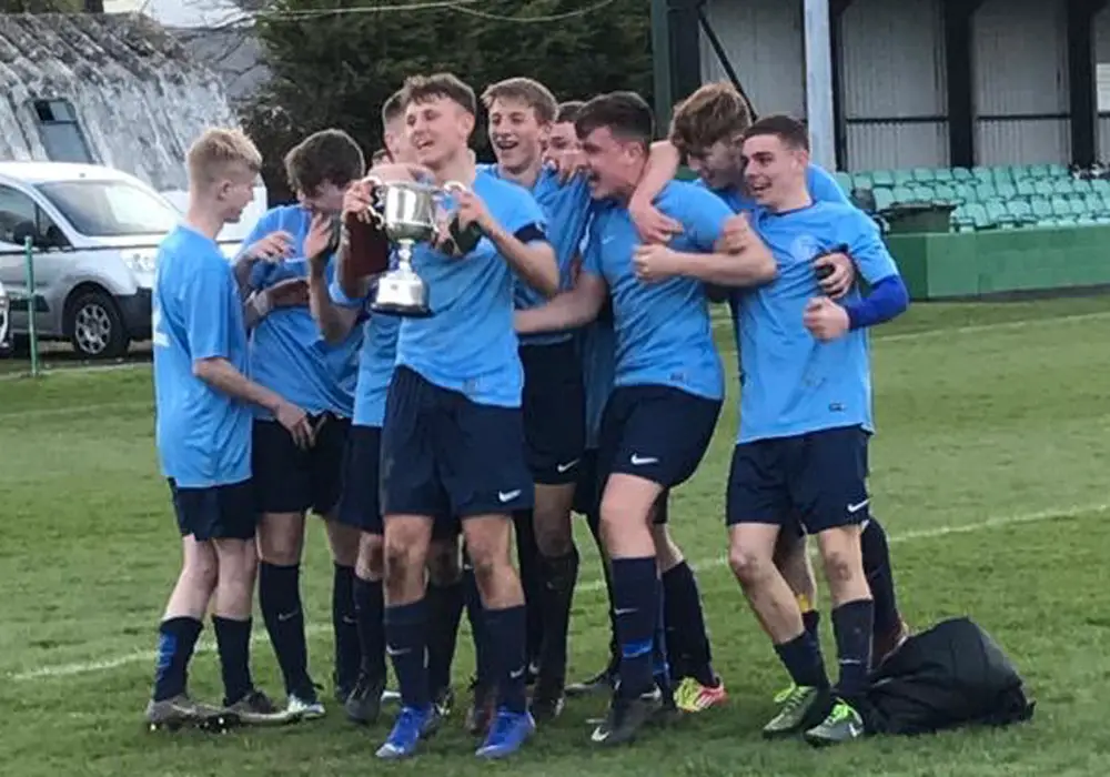Berks & Bucks under 18s celebrate the South & West County Championship title.