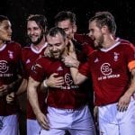 Bracknell Town celebrate with Jamie McClurg. Photo: Neil Graham.