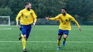 Ian Davies celebrates with Luqman Kassim