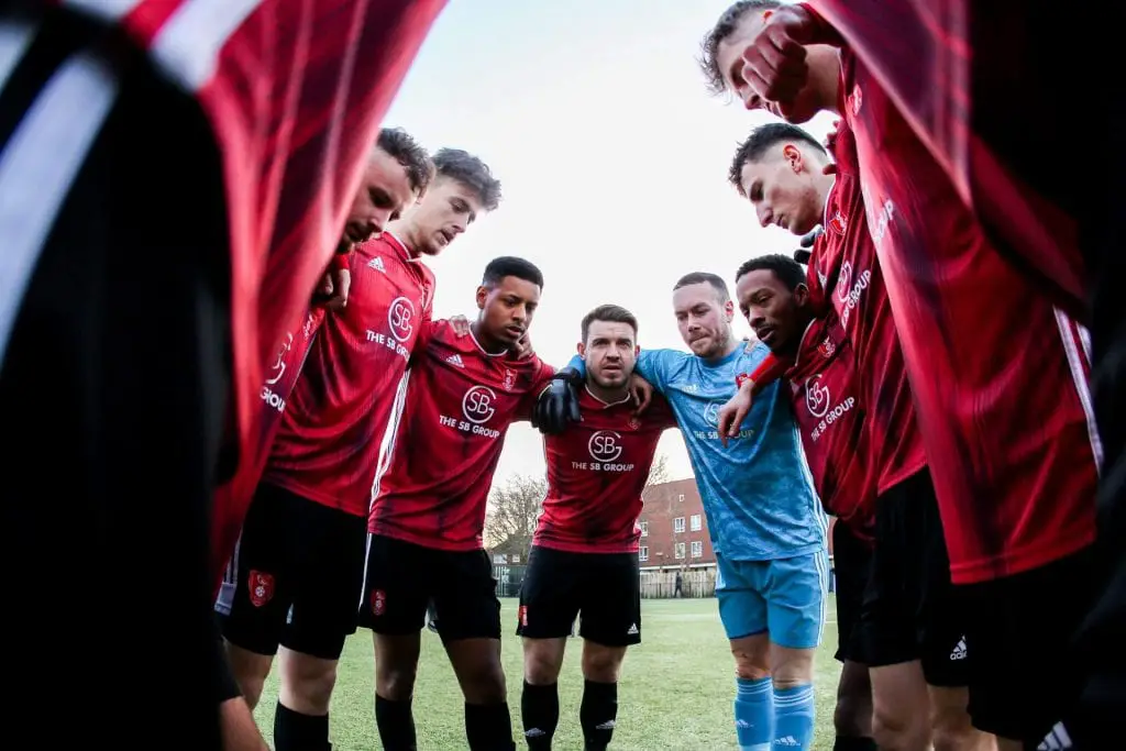 Bracknell Town huddle before Hanwell Town game. Photo: Neil Graham / ngsportsphotography.com