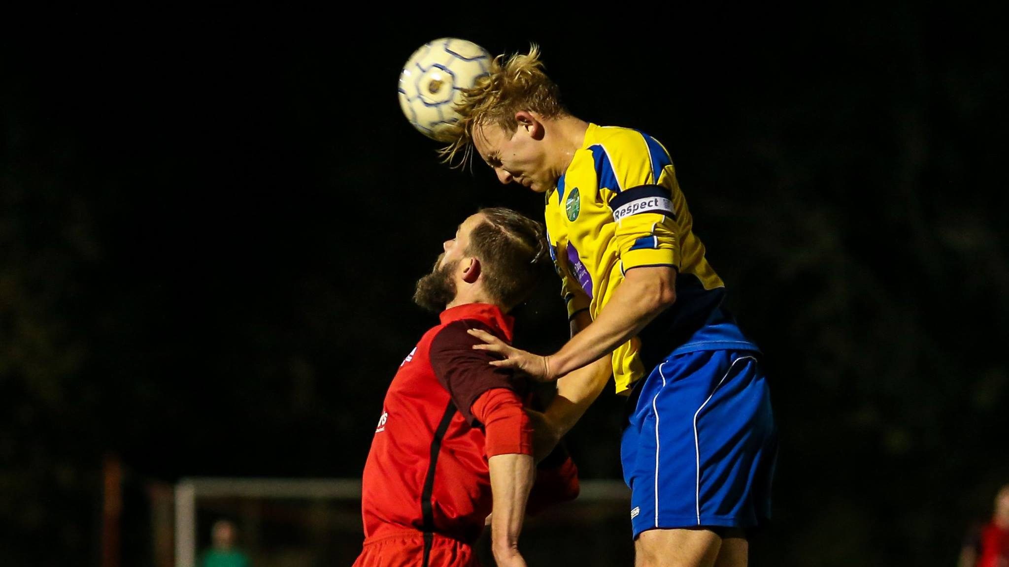 Louis Bouwers rises above Ian Davies as Ascot United and Binfield clash. Photo: Neil Graham / ngsportsphotography.com