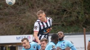 Alfie Kilgour challenges for a header