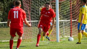 Asa Povey celebrates scoring against Westfields. Photo: Neil Graham / ngsportsphotography.com