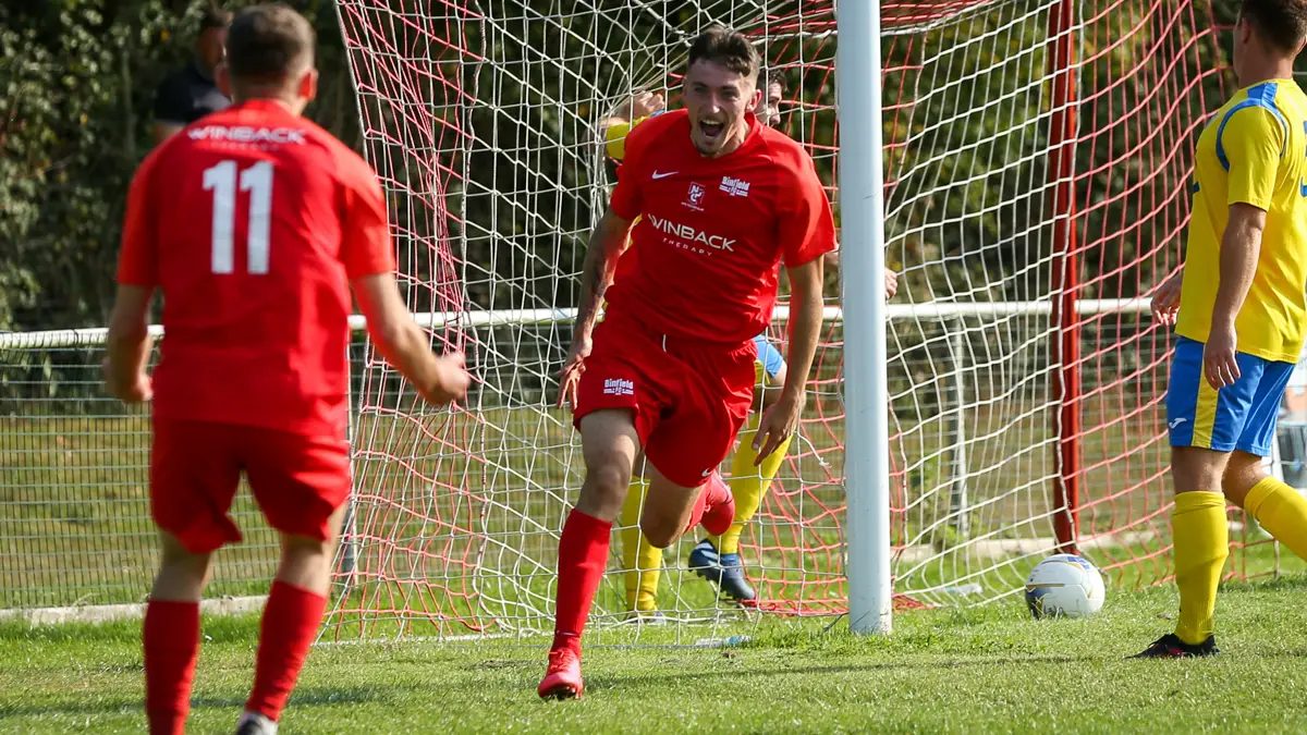 Asa Povey celebrates scoring against Westfields. Photo: Neil Graham / ngsportsphotography.com