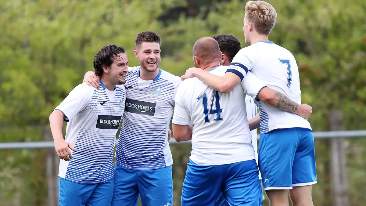 Lewis Robson celebrates with Eversley team mates. Photo: Richard Milam.