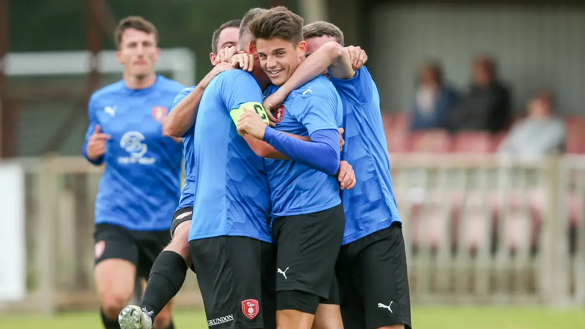 Seb Bowerman celebrates with his Bracknell Town team mates. Photo: Neil Graham / ngsportsphotography.com