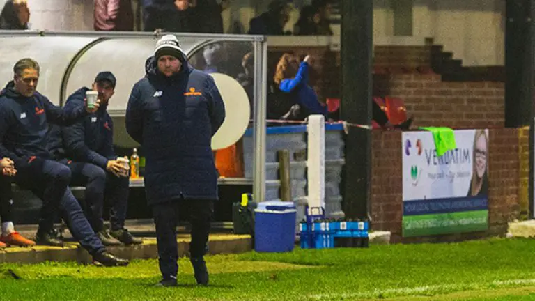Hungerford Town boss Danny Robinson in the dugout. Photo: Darren Woolley / darrenwoolley.photos