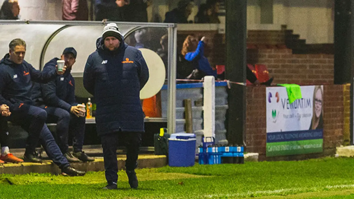Hungerford Town boss Danny Robinson in the dugout. Photo: Darren Woolley / darrenwoolley.photos