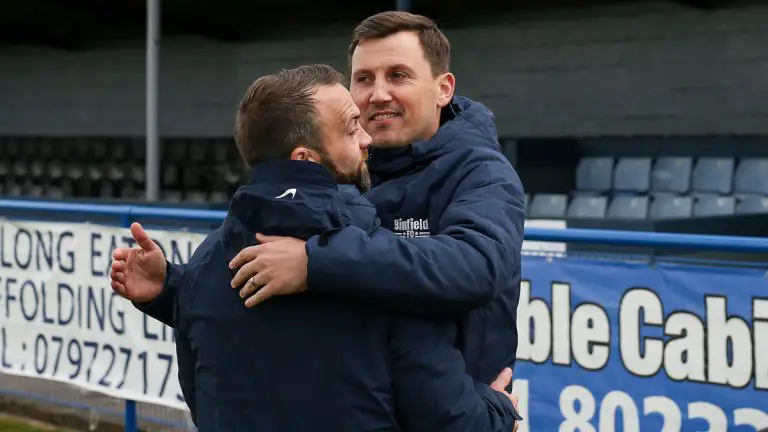 Carl Withers and Jamie McClurg embrace after the Long Eaton United win. Photo: Neil Graham / ngsportsphotography.com