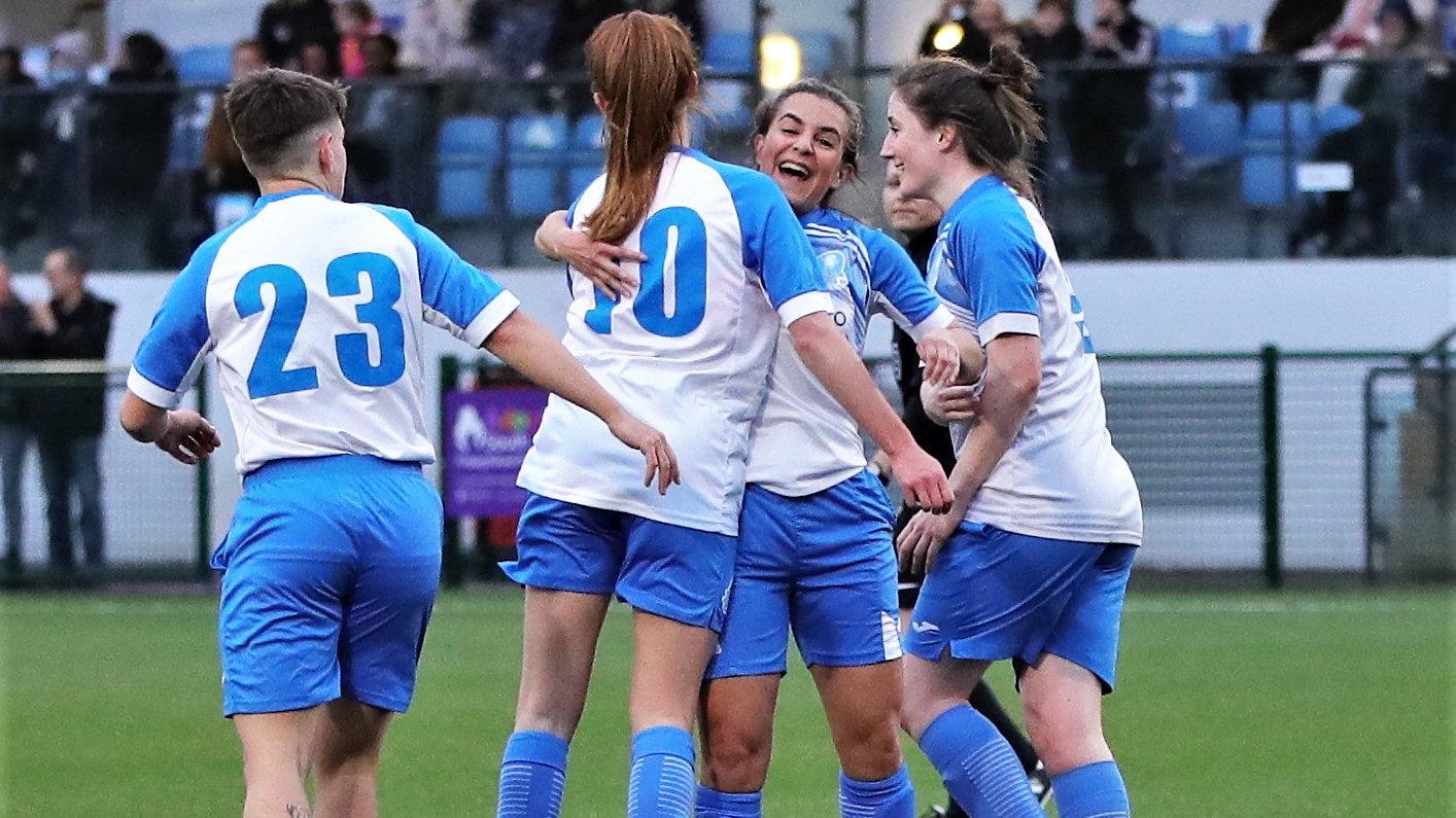Eversley & California Ladies celebrate a goal. Photo: Richard Milam