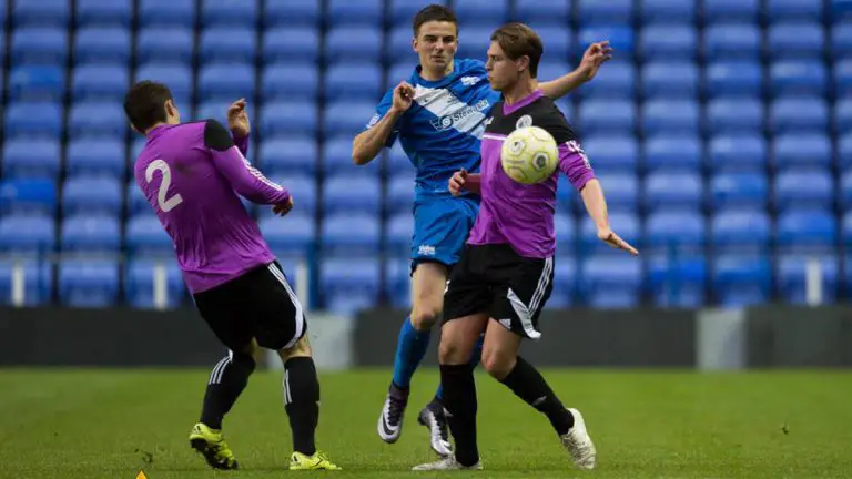 Sean Moore and Josh Howell challenge for the ball. Photo: Rob Mack.