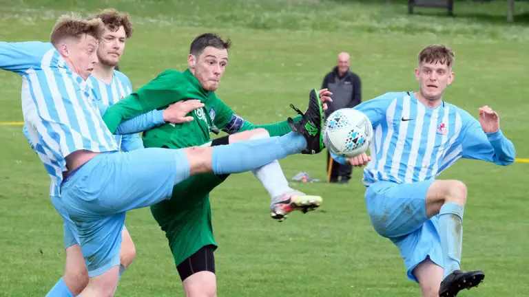 Finchampstead's Dan Pawson (right), James Payne (left) and Ryan Finch challenge with Berks County captain Dan Money. Photo: Andrew Batt / contentello.smugmug.com