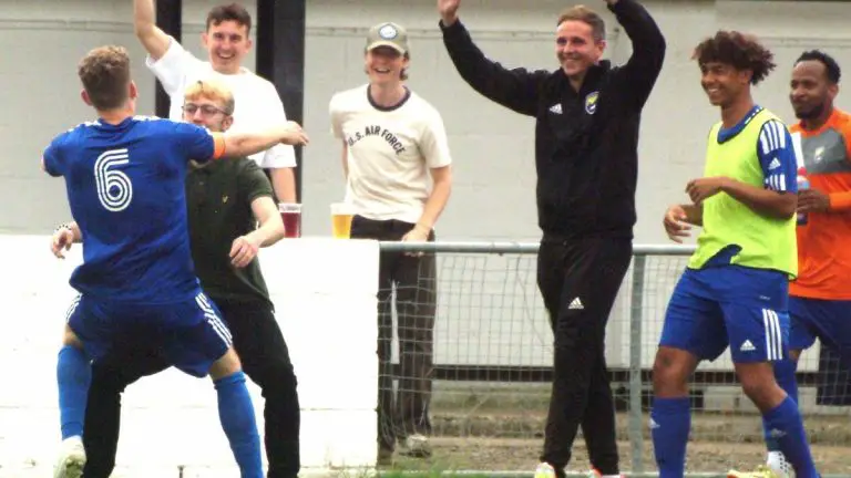 Alfie Grant celebrates scoring against Southall with the Reading City bench. Photo: Peter Toft.