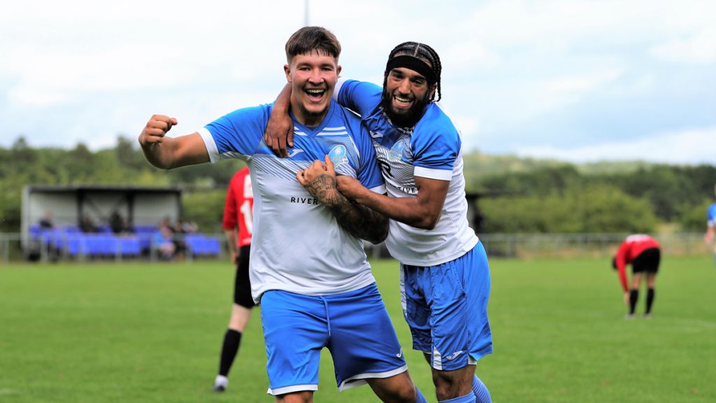 Eversley & California's Reece Buckett celebrates with Paras Gill. Photo: Richard Milam.