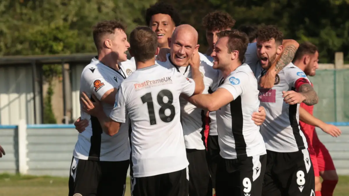 Keith Emmerson is mobbed after scoring for Hungerford Town in the FA Cup. Photo: Jeff Youd.