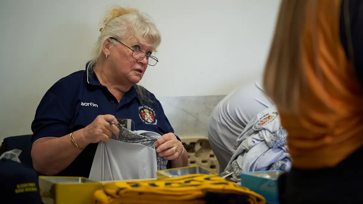 Sue Shiel at work in the Slough Town club shop. Philip J.A Benton/philipbenton.com