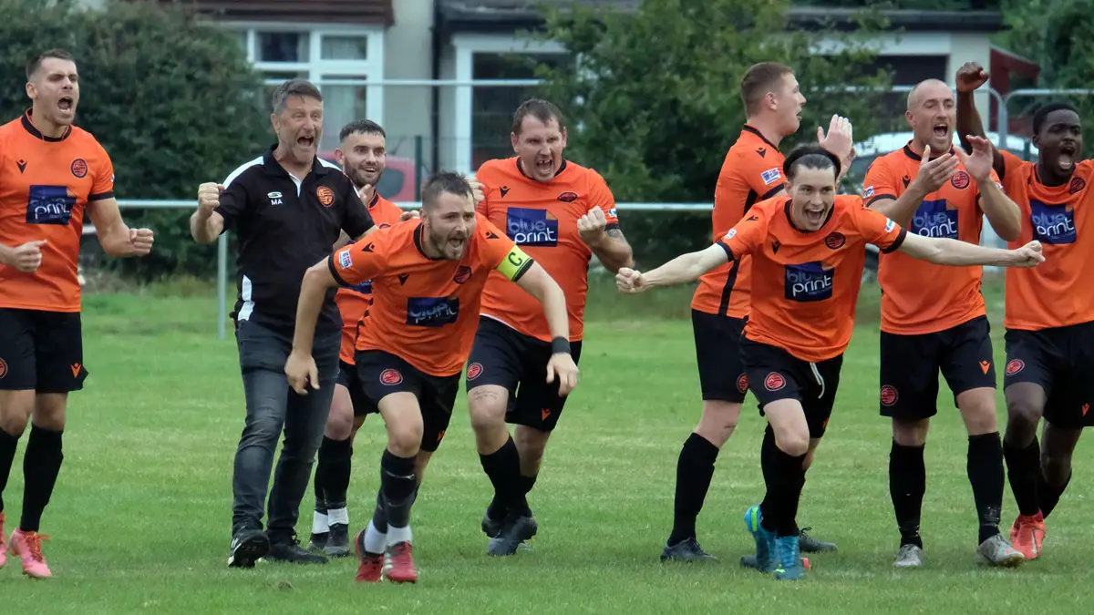 Wokingham & Emmbrook celebrate their penalty shoot out win. Photo: Andrew Batt.
