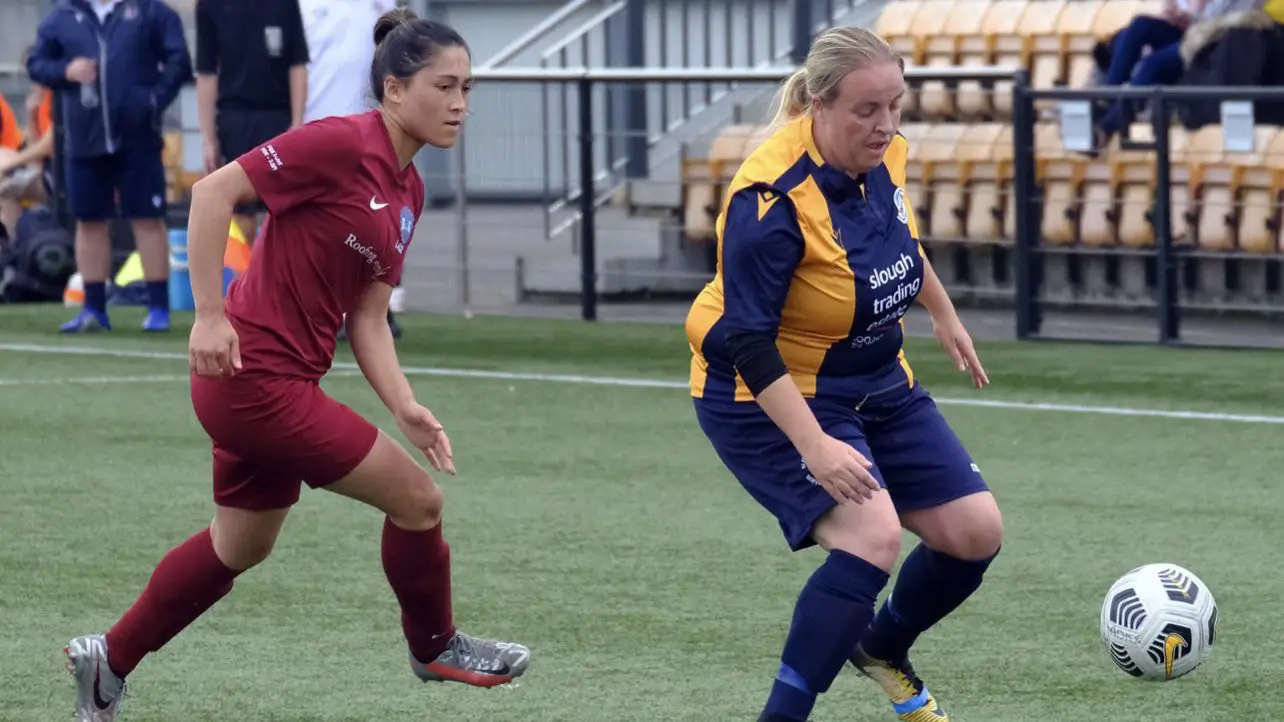Charisse Tregear chases down Shannon Daly during their Berks & Berks County Cup fixture. Photo: Andrew Batt.