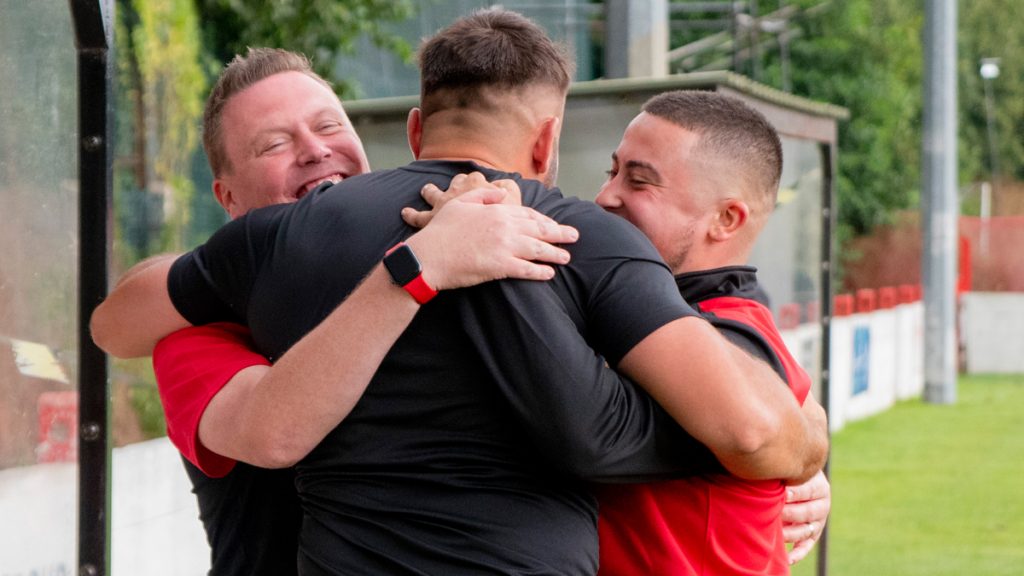 Lee Matthews celebrates with his Wallingford Town management team. Photo: Cameron Howard.