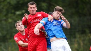 Joe Gater and Dan Bayliss challenge for the ball. Photo: Neil Graham / ngsportsphotography.com