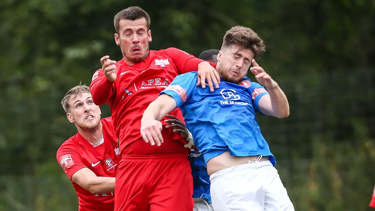 Joe Gater and Dan Bayliss challenge for the ball. Photo: Neil Graham / ngsportsphotography.com