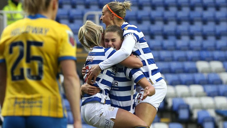 Emma Harries is mobbed by her Reading FC Women teammates. Photo: Neil Graham / ngsportsphotography.com