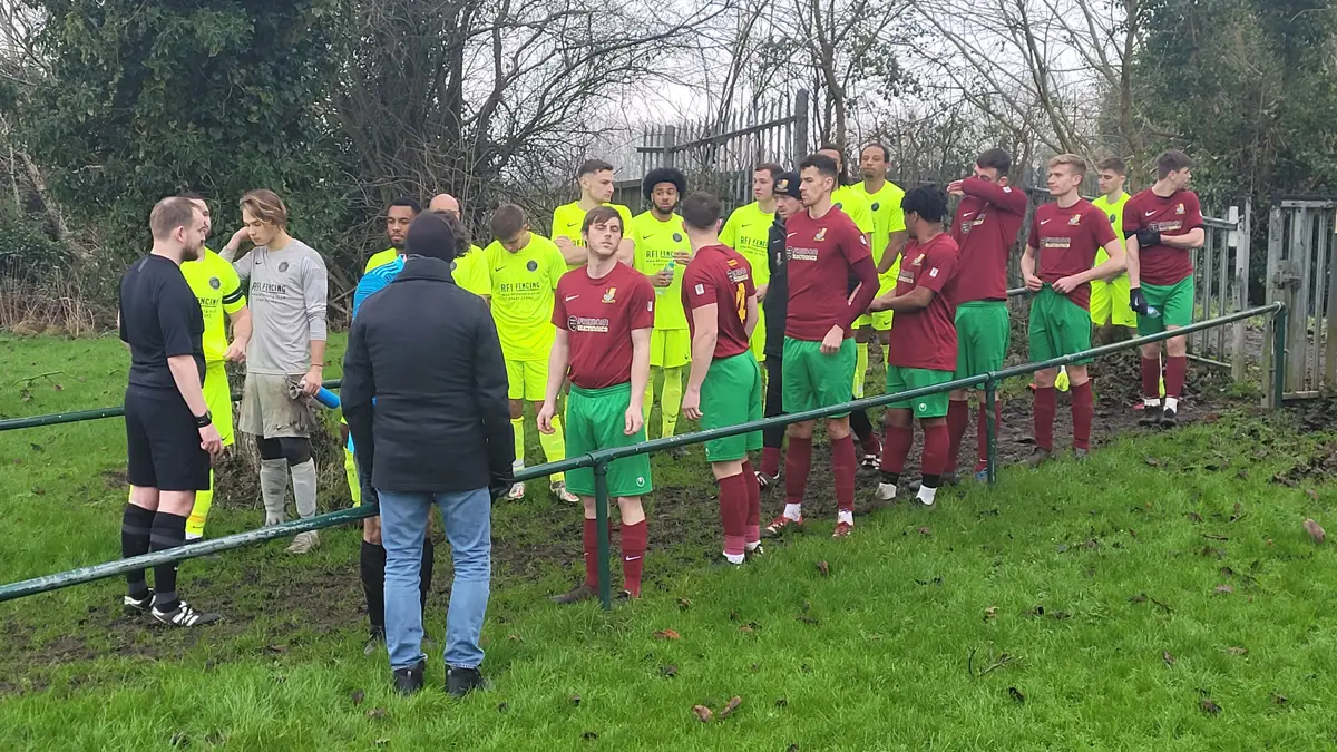 Holyport and Virginia Water players line up. Photo: Neil Maskell