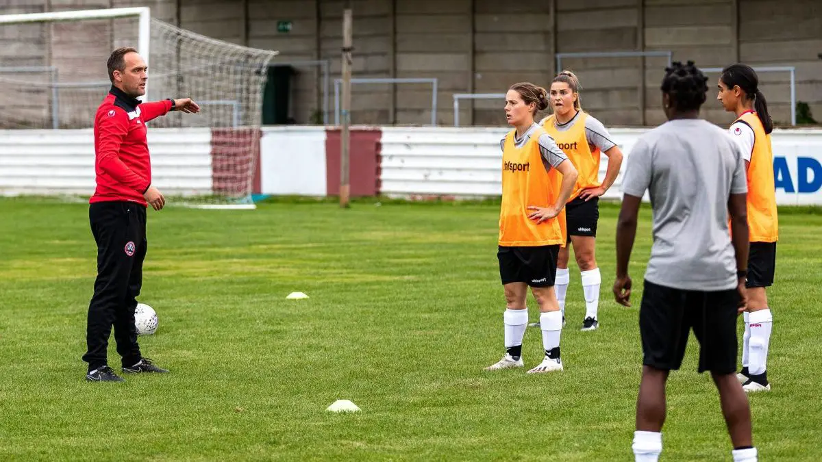 Magpies manager Ryan Taylor discusses pre-match tactics before Maidenhead United meet Chesham Ladies at The Meadow, Chesham Photo: Darren Woolley