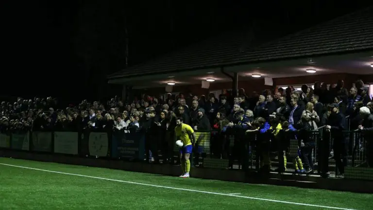 Ascot United's Chris Ellis is lost in the Racecourse crowd. Photo: Neil Graham.