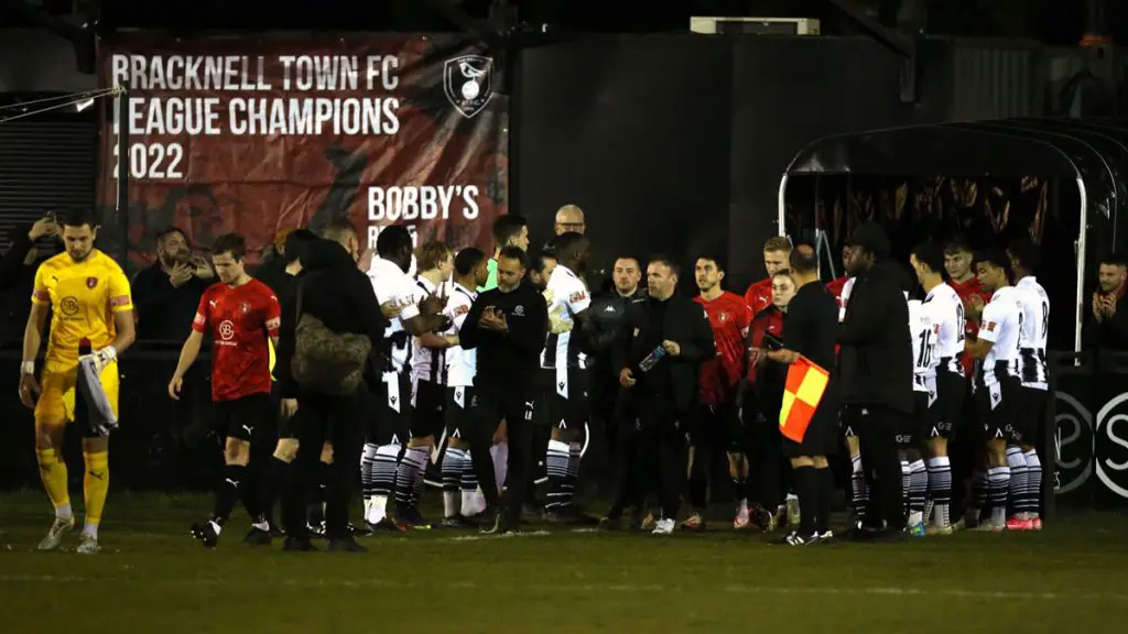 Bracknell Town walk out to a guard of honour from Tooting & Mitcham United. Photo: Neil Graham.