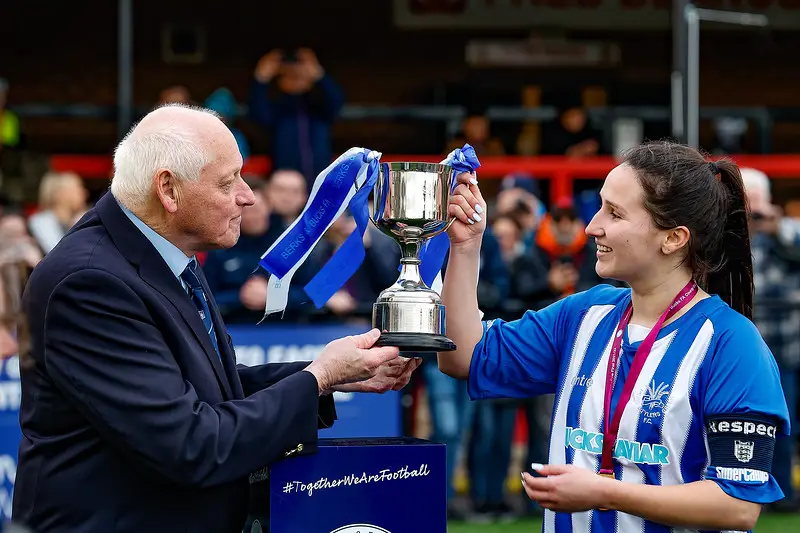 Penn & Tylers Green Ladies captain, Rachael Harnby is presented with the trophy Photo: Oakmist Photography