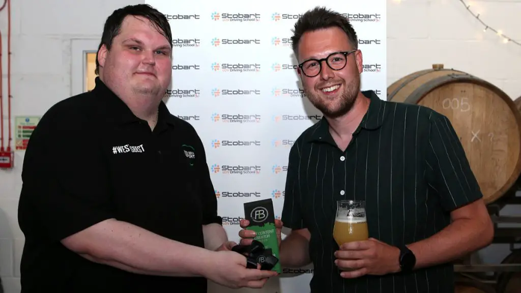 'Tommie Tank' accepts the Content Creator Award from Severn Sport's Ryan Butler. Photo: Neil Graham