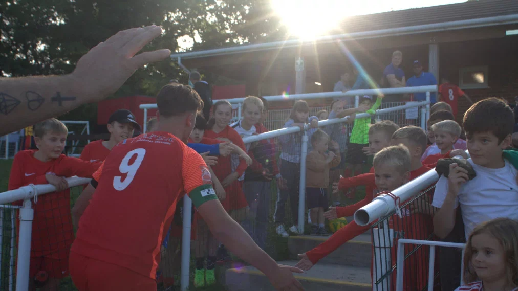 Binfield Captain Sean Moore is congratulated by supporter ls after the FA Cup win. Photo: Daisy Spiers.