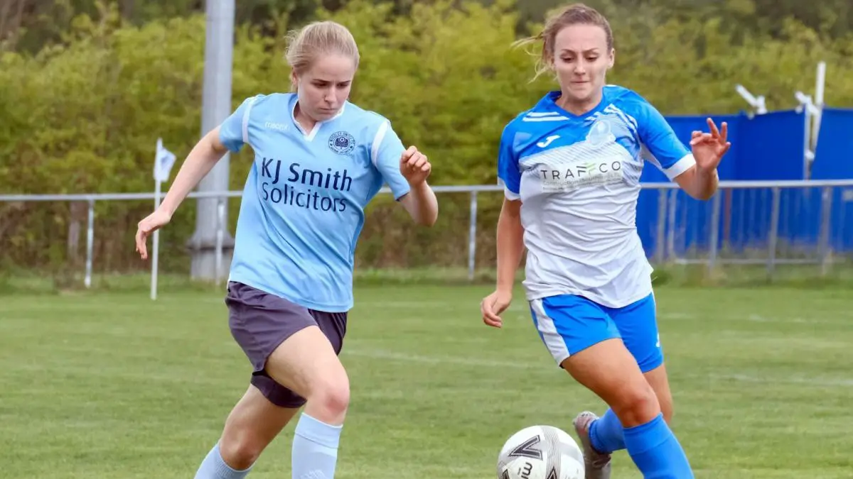 Woodley United battle it out against Eversley and California in the Southern Region Women's Football League Photo: Andrew Batt