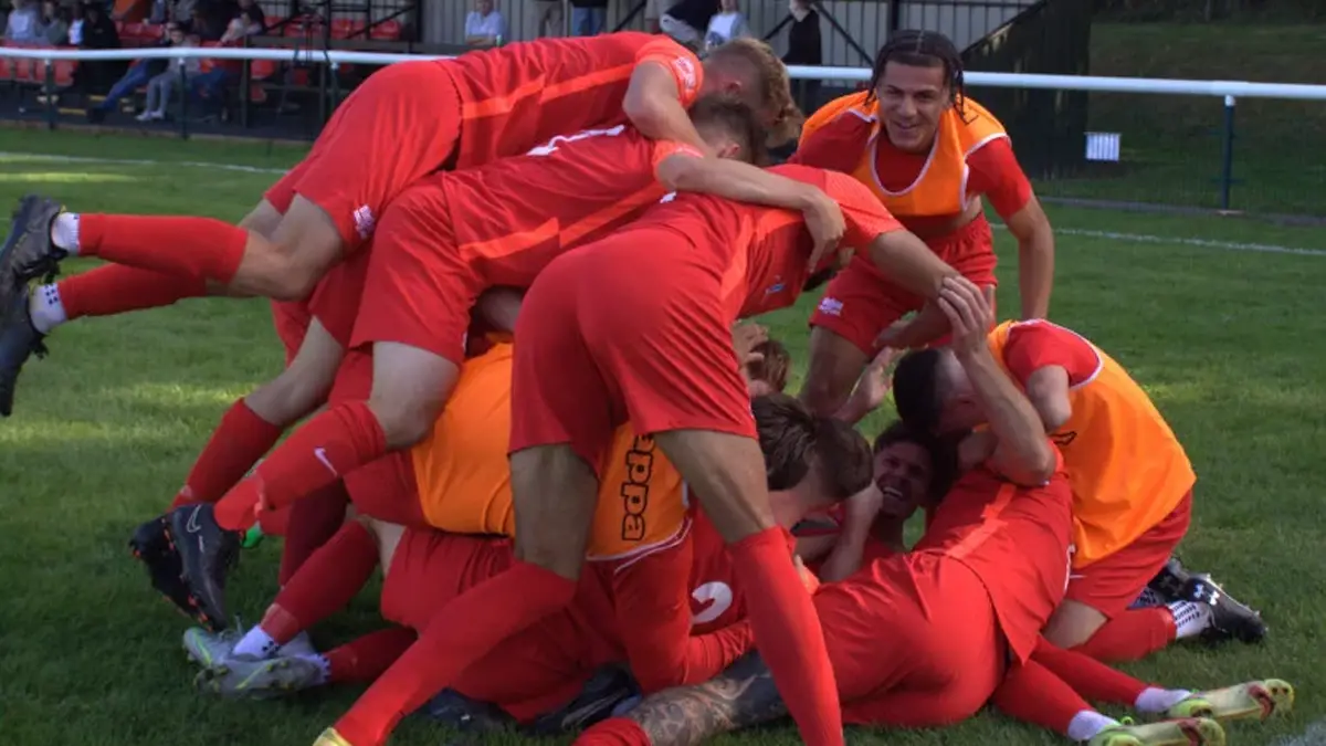 The Binfield players attempt to finish cutting the grass before the arrival of Tonbridge Angels. Photo: Daisy Spiers.
