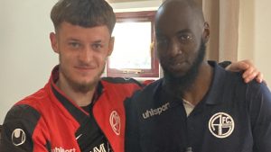 Kacper Malinowski with AFC Aldermaston coach Hamzah Collins.