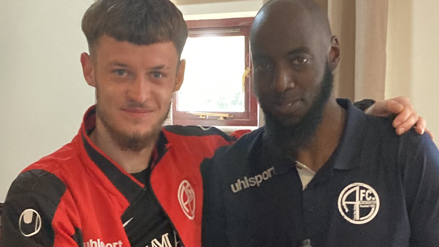 Kacper Malinowski with AFC Aldermaston coach Hamzah Collins.